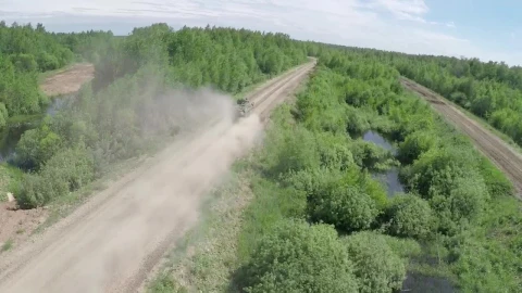 Stock Video Military Vehicle Heading Down A Dusty Roa Animated Wallpaper - Free Live Wallpaper