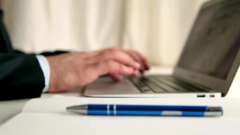Stock Video Men Taking Note While Browsing In A Lapto Animated Wallpaper - Free Live Wallpaper