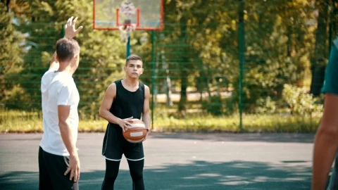 Stock Video Men Playing Basketball On An Outdoor Cour Animated Wallpaper - Free Live Wallpaper