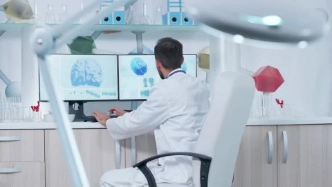 Stock Video Medical Scientist Works On Brain Models In La Animated Wallpaper - Free Live Wallpaper