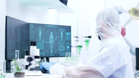 Stock Video Medical Scientist Types And Looks At Human Body Sca Animated Wallpaper - Free Live Wallpaper