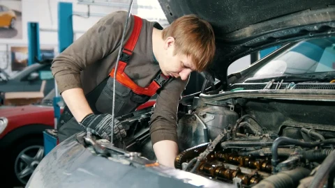Stock Video Mechanic Working Under The Hood Of A Ca Animated Wallpaper - Free Live Wallpaper