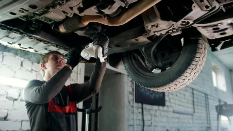 Stock Video Mechanic Working In The Bottom Of A Ca Animated Wallpaper - Free Live Wallpaper