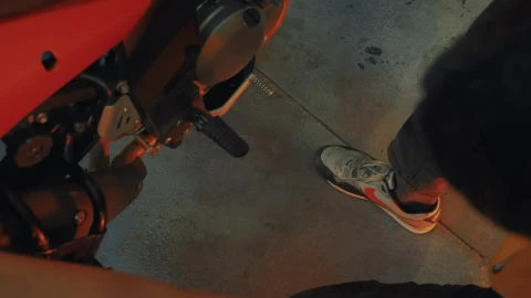 Stock Video Mechanic Looking At A Motorcycle In A Worksho Animated Wallpaper - Free Live Wallpaper