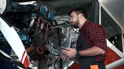 Stock Video Mechanic Inspecting An Airplane Engin Animated Wallpaper - Free Live Wallpaper