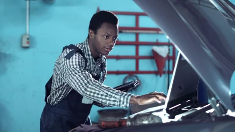Stock Video Mechanic Checking A Car Motor With Compute Animated Wallpaper - Free Live Wallpaper