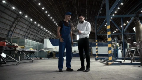 Stock Video Mechanic And Engineer Walking In The Hanga Animated Wallpaper - Free Live Wallpaper