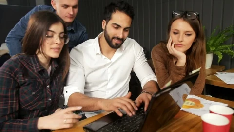 Stock Video Marketing Team Gather Around Laptop And Smile At Camer Animated Wallpaper - Free Live Wallpaper
