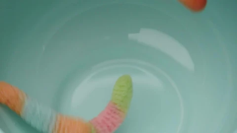 Stock Video Many Sugary Gum Worms Falling Into A Bow Animated Wallpaper - Free Live Wallpaper