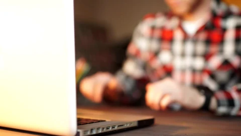 Stock Video Man Working On Laptop Looks At His Smart Watc Animated Wallpaper - Free Live Wallpaper