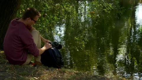 Stock Video Man Working On A Tablet In The Lakeshor Animated Wallpaper - Free Live Wallpaper