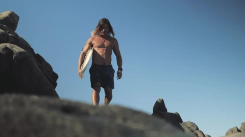 Stock Video Man With Surfboard Walks On Rocks At The Se Animated Wallpaper - Free Live Wallpaper