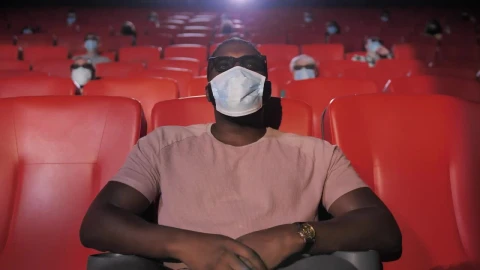 Stock Video Man With Mask Sitting In A Movie Theate Animated Wallpaper - Free Live Wallpaper