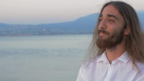 Stock Video Man With Long Hair And A Beard Looking Awa Animated Wallpaper - Free Live Wallpaper