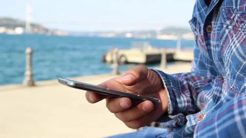 Stock Video Man With His Cell Phone In Hand Near A Sunn Animated Wallpaper - Free Live Wallpaper