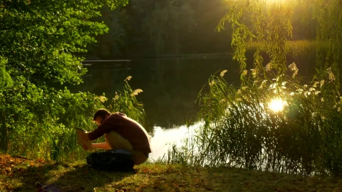 Stock Video Man With A Lap Top On The Shore Of Animated Wallpaper - Free Live Wallpaper