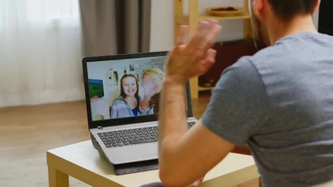 Stock Video Man Waves Hello To Family On Video Cal Animated Wallpaper - Free Live Wallpaper