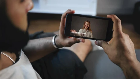 Stock Video Man Watching A Video On His Smartphon Animated Wallpaper - Free Live Wallpaper