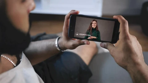 Stock Video Man Watches Youtube Influencer Asks For Subscribers To Click Lik Animated Wallpaper - Free Live Wallpaper