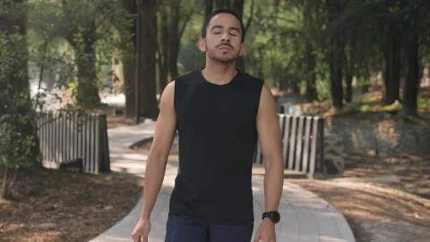 Stock Video Man Warming Up In A Park Before Exercisin Animated Wallpaper - Free Live Wallpaper