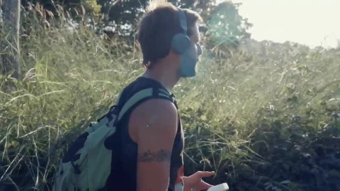 Stock Video Man Walking In Nature With Music On His Headphone Animated Wallpaper - Free Live Wallpaper
