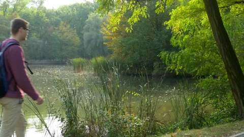 Stock Video Man Walking By The Riverside Takes A Brea Animated Wallpaper - Free Live Wallpaper