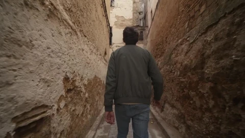 Stock Video Man Walking Along An Old Narrow Alley Trackin Animated Wallpaper - Free Live Wallpaper