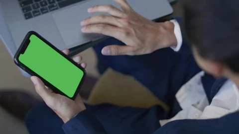 Stock Video Man Using His Computer And Cell Phon Animated Wallpaper - Free Live Wallpaper