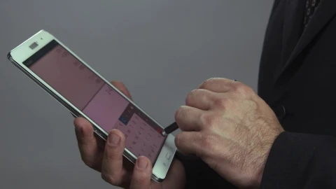 Stock Video Man Using A Tax Calculato Animated Wallpaper - Free Live Wallpaper