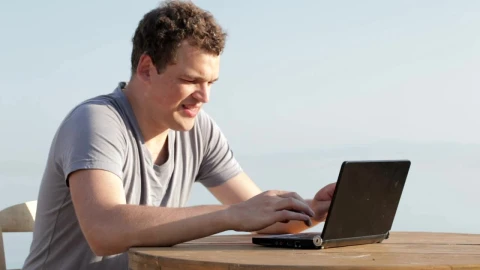 Stock Video Man Typing On A Small Personal Compute Animated Wallpaper - Free Live Wallpaper