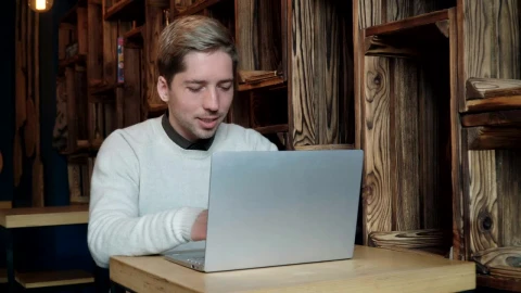 Stock Video Man Typing On A Laptop In A Caf Animated Wallpaper - Free Live Wallpaper