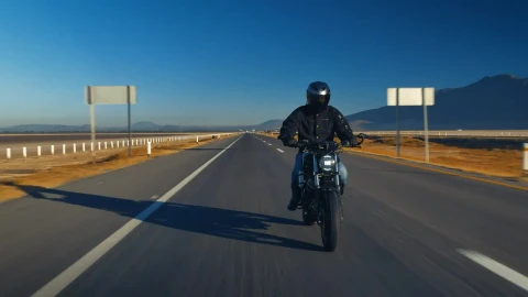 Stock Video Man Traveling By Motorcycle On An Empty Roa Animated Wallpaper - Free Live Wallpaper