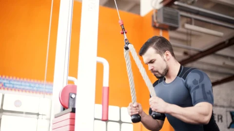 Stock Video Man Training With A Pull Down Weight Machin Animated Wallpaper - Free Live Wallpaper