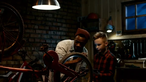 Stock Video Man Teaching A Boy Bicycle Maintenanc Animated Wallpaper - Free Live Wallpaper