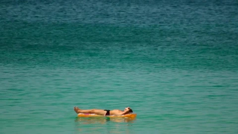Stock Video Man Sunbathing In The Ocea Animated Wallpaper - Free Live Wallpaper