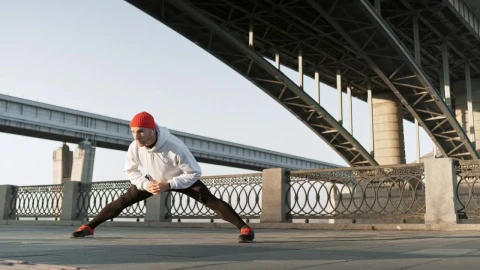 Stock Video Man Stretching His Body Before An Urban Workou Animated Wallpaper - Free Live Wallpaper