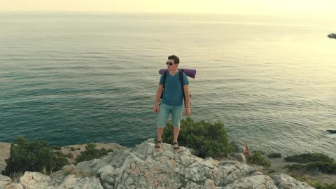 Stock Video Man Standing On A Cliff Facing The Se Animated Wallpaper - Free Live Wallpaper