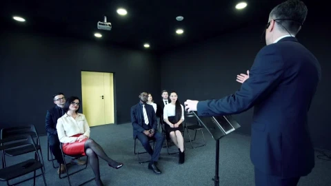 Stock Video Man Speaking In Front Of A Small Audienc Animated Wallpaper - Free Live Wallpaper