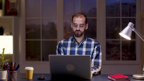 Stock Video Man Smiles While Thinking And Working From Hom Animated Wallpaper - Free Live Wallpaper