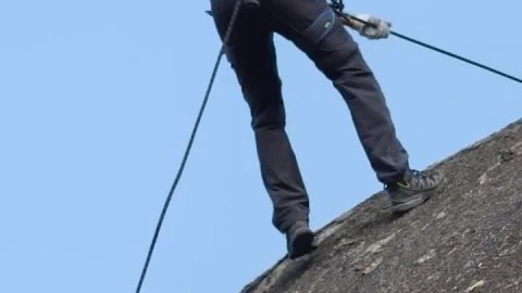 Stock Video Man Slowly Descending Rocky Mountai Animated Wallpaper - Free Live Wallpaper
