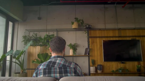 Stock Video Man Sitting On A Couch Uses Virtual Reality Glasse Animated Wallpaper - Free Live Wallpaper