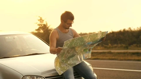 Stock Video Man Sitting In His Car Looks At A Map O Animated Wallpaper - Free Live Wallpaper