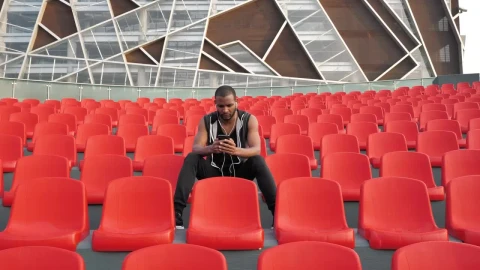 Stock Video Man Sits In Orange Chair Listening To Musi Animated Wallpaper - Free Live Wallpaper