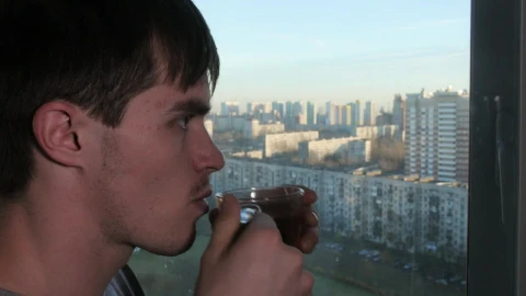 Stock Video Man Sipping Tea By The Windo Animated Wallpaper - Free Live Wallpaper