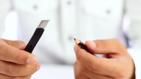 Stock Video Man Sharpening A Pencil With A Cutte Animated Wallpaper - Free Live Wallpaper