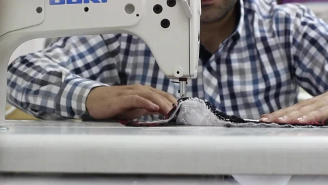 Stock Video Man Sewing A Garment On A Sewing Machin Animated Wallpaper - Free Live Wallpaper