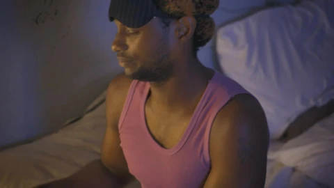 Stock Video Man Setting His Alarm Clock Before Going To Slee Animated Wallpaper - Free Live Wallpaper