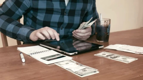 Stock Video Man Separating Money For Different Budget Animated Wallpaper - Free Live Wallpaper