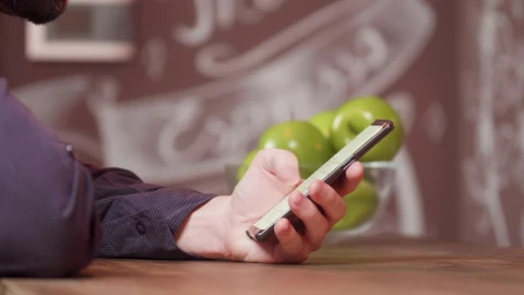 Stock Video Man Scrolling Through His Cellphon Animated Wallpaper - Free Live Wallpaper