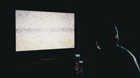Stock Video Man Scrolling A Phone In Front Of A Televisio Animated Wallpaper - Free Live Wallpaper